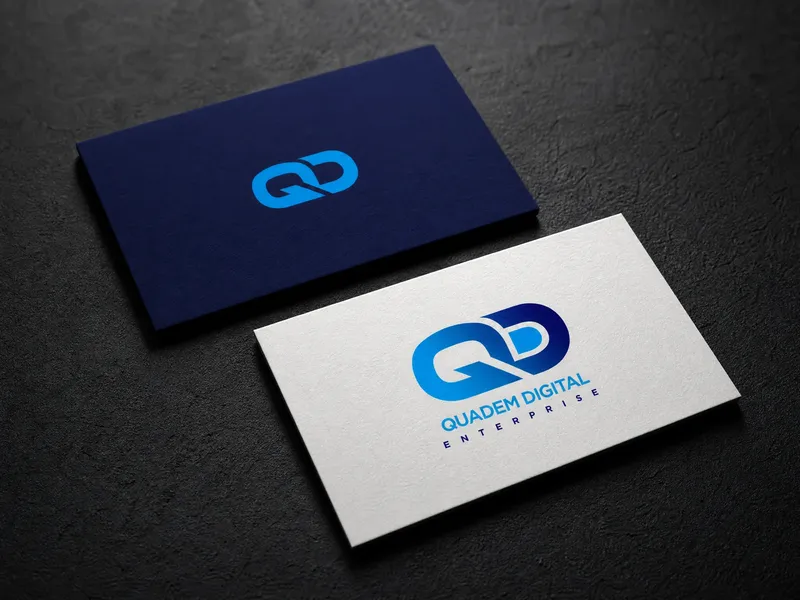 Quadem Digital business cards in white and navy showing the QD monogram